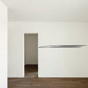 Pinstripe vinyl decal with two thin black stripes and angled end on wall