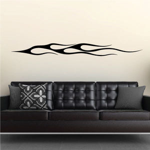 Vehicle pinstripe vinyl decal, black flame stripe design on a wall
