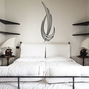 Pinstripe vinyl decal with black swirl feather pattern on a wall
