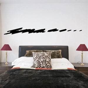 Vehicle pinstripe vinyl decal with black solid and dashed stripe on wall