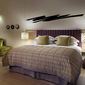 Black pinstripe vinyl wall decal, long horizontal stripe design above bed