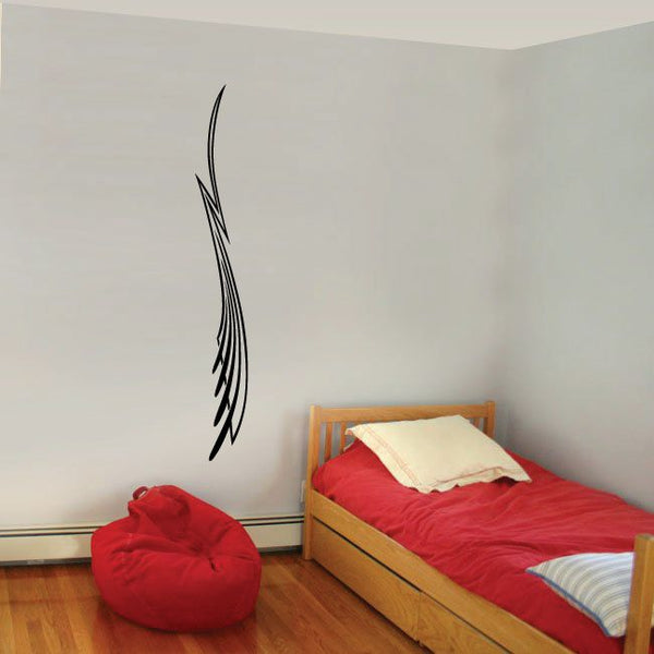 Black pinstripe vinyl decal with curved arrow-like flame design on wall