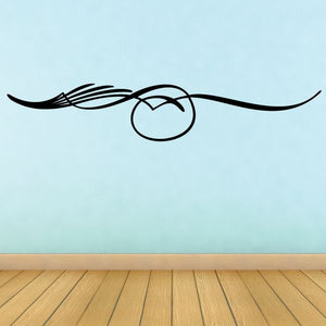 Pinstripe vinyl decal with black curvy lines and centered round emblem