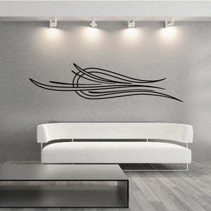 Vehicle pinstripe vinyl decal with black sweeping stripe lines on wall