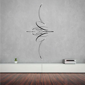Black vehicle pinstripe vinyl decal with swooping tribal-style lines on wall