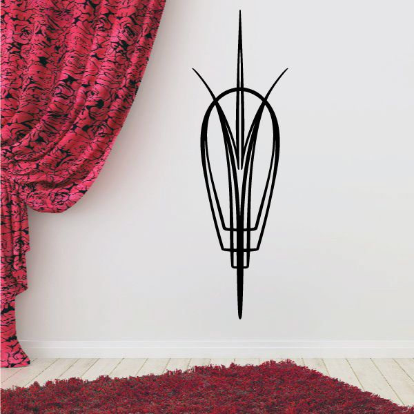 Black pinstripe vinyl decal of a vehicle emblem, tall outline on wall