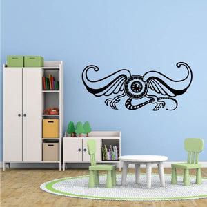 Ornate pinstripe vinyl wall decal with circular emblem and winged scrolls