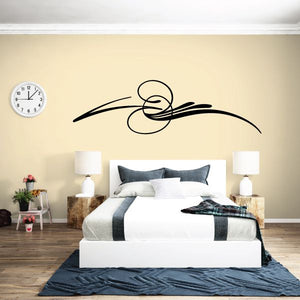 Vehicle pinstripe vinyl decal with sweeping black swirl and curved line accents