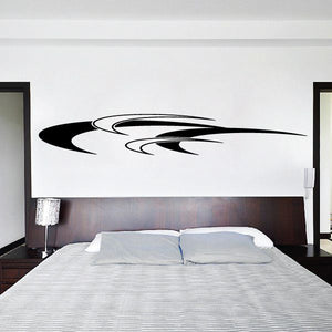 Vehicle pinstripe vinyl decal with black swoosh stripes on a wall