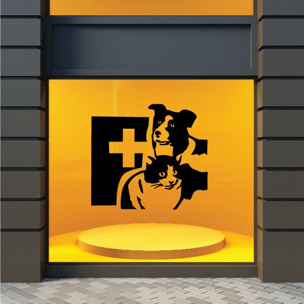 Veterinary decal with black dog and cat beside a medical cross, on a yellow background