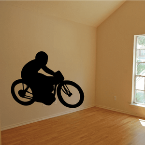 Motorcycle racer decal in black silhouette on a motorcycle with helmet and wheels