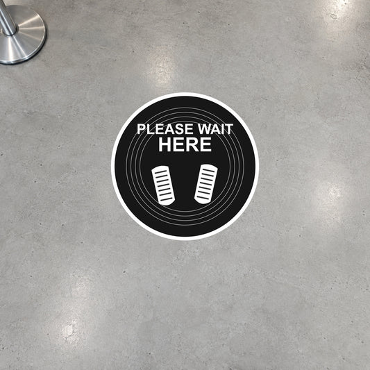 12-inch round floor sticker reading “PLEASE WAIT HERE” with white icon