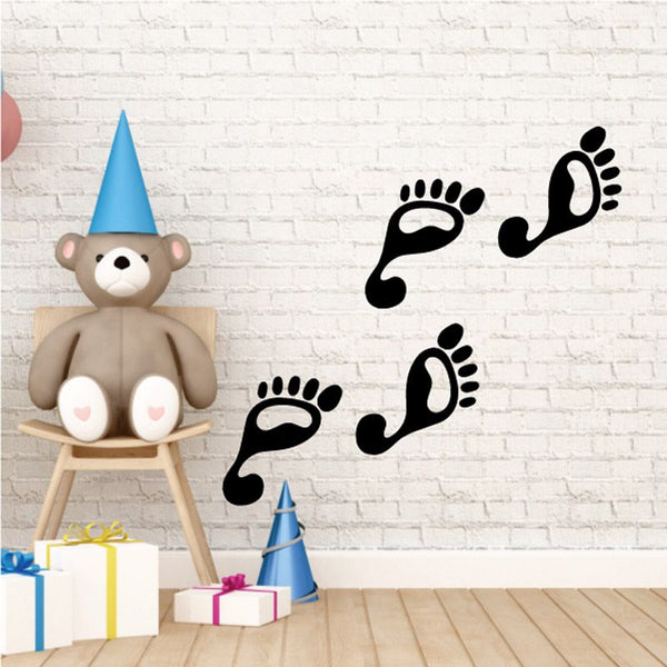 Walking feet decal with black paw-print footprints and two legs on white surface