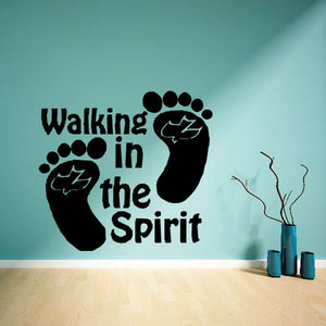 Black wall decal reading 'Walking in the Spirit' with footprint icons