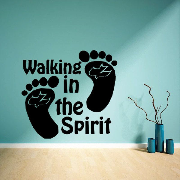Black wall decal reading 'Walking in the Spirit' with footprint icons