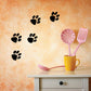 Black paw print wall decal set with several prints and two larger prints