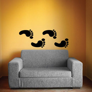 Black footprint wall decal with two pairs of foot print icons