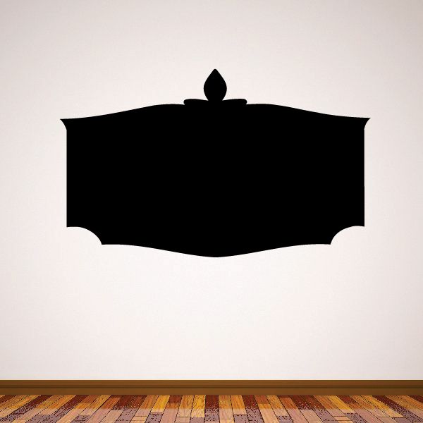 Black vinyl wall decal shaped like a pointed shield banner