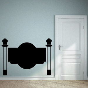 Vinyl wall decal featuring black fence posts and center circle emblem
