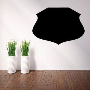 Black shield-shaped vinyl wall decal