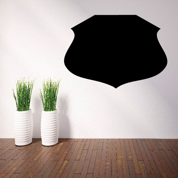 Black shield-shaped vinyl wall decal