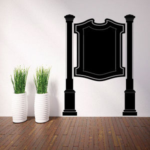 Black vinyl wall decal with two columns and central shield crest