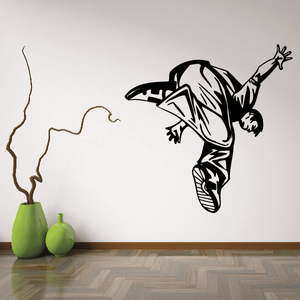 Parkour wall decal of a black-and-white jumping figure in midair.