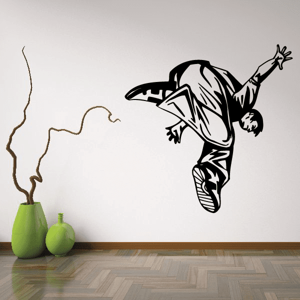 Parkour wall decal of a black-and-white jumping figure in midair.
