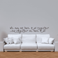 Wall quote decal with handwritten text on a light wall
