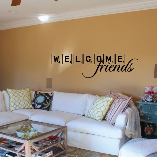 Tile wall decal reading Welcome Friends with black letter squares and script