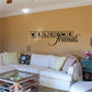 Tile wall decal reading Welcome Friends with black letter squares and script
