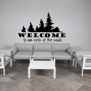 Wall decal: black tree silhouette with 'WELCOME' and 'to our neck of the woods' text