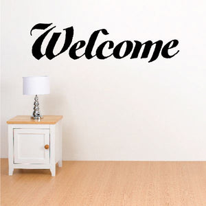 Welcome vinyl wall decal with black cursive "Welcome" lettering