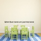 Wall decal text: “Where Busy Hands are Learning Hands”