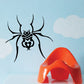 Black stylized spider decal with heart-like emblem and long legs