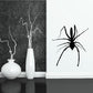 Black spider wall decal with long legs in a simple silhouette
