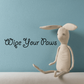 Cursive wall decal that reads "Wipe Your Paws"