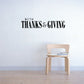 Thanksgiving wall decal with bold text "WITH THANKS & GIVING"