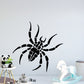 Black spider wall decal with oversized legs and webbed body