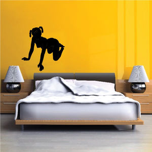 Black silhouette decal of a woman with pigtails, kneeling pose