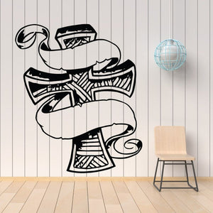 Wooden cross with scrollwork decal, black outline on light background
