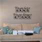 Inspirational wall decal with script text and word blocks reading "SAND" and "STONE"