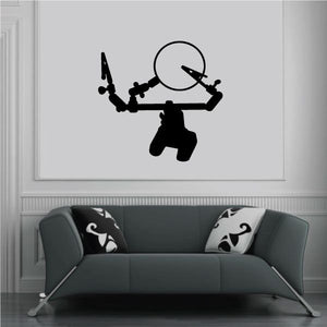 Mounted holder wall decal featuring black magnifying glass and grip