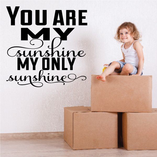Wall decal with bold black quote text and decorative sunshine swirls