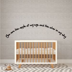 Wall decal with black cursive quote: “apple of my eye” and “star in my sky”