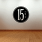 Circular black wall decal with white “16” and “YEARS” text