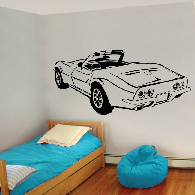Black outline Corvette decal with front grille and headlights on white wall