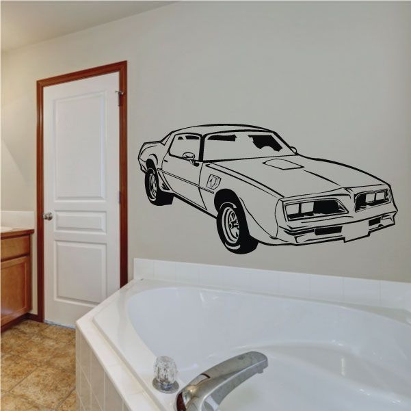 Black line-art muscle car decal on a light wall