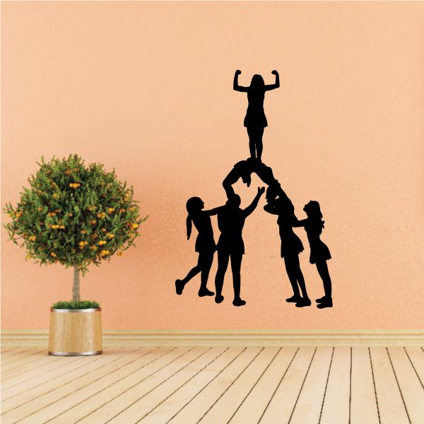 Cheerleading pyramid wall decal with black silhouette cheerleaders holding bases and top