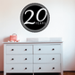 Black circular 20 years celebration decal with white 20 YEARS text